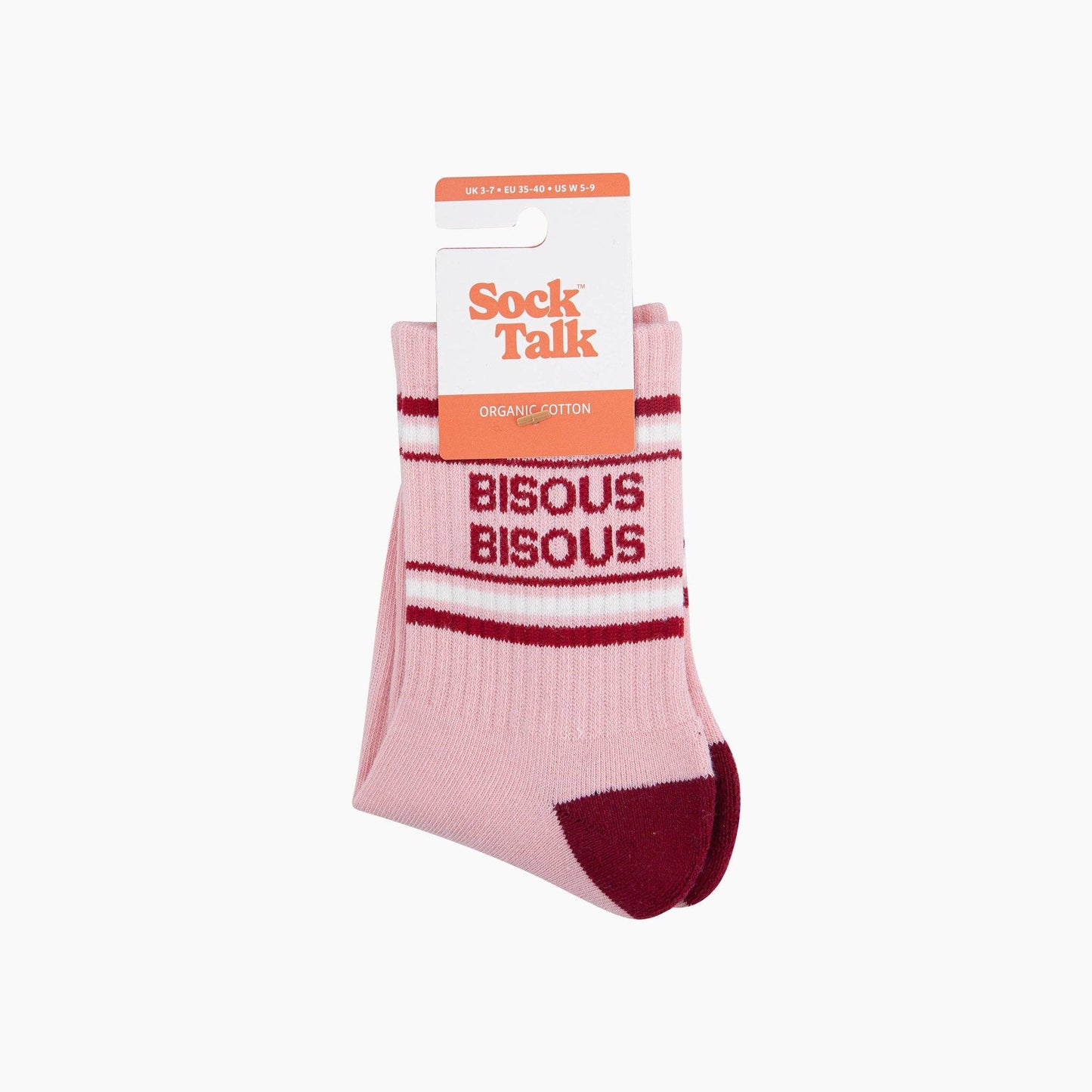 Pink socks with 'Bisous Bisous' text and red accents in packaging on a white background