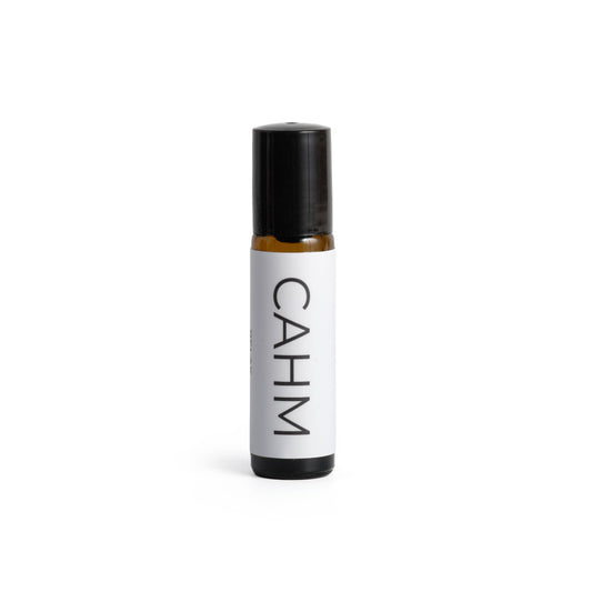 Small bottle with black cap and white label displaying 'CAHM' on a white background
