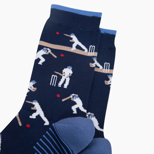 Navy blue socks with cricket-themed design on a white background