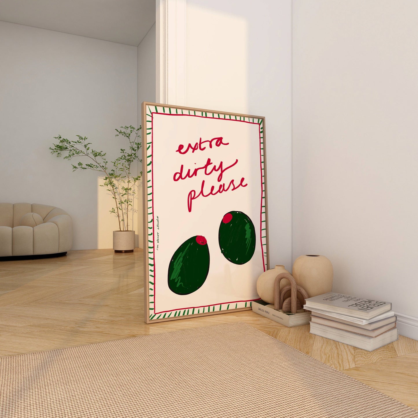 2 green olives with the words extra dirty please written with a striped green and red border.