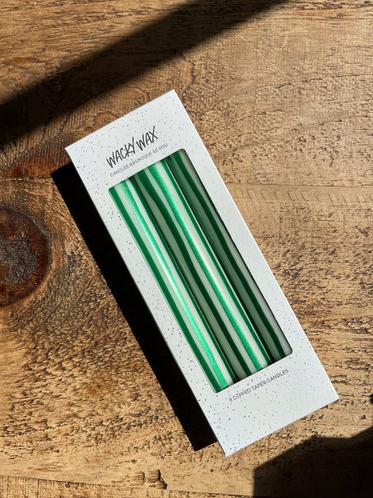 Green and white vertical striped candles