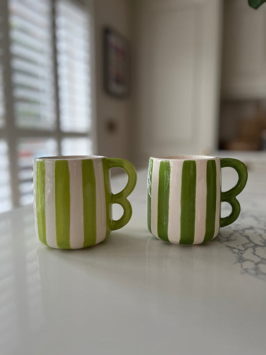 Green striped mugs with wavy handle