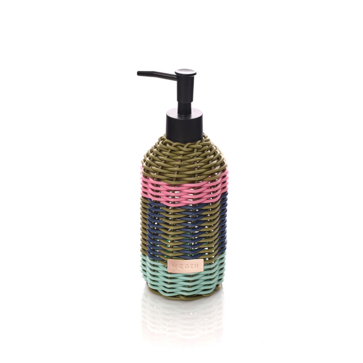 A woven bottle with a black pump dispenser, featuring horizontal stripes of olive green, pink, navy blue, and mint green, with a small gold label on a white background.