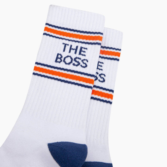 White socks with orange and blue stripes and 'THE BOSS' text on a white background