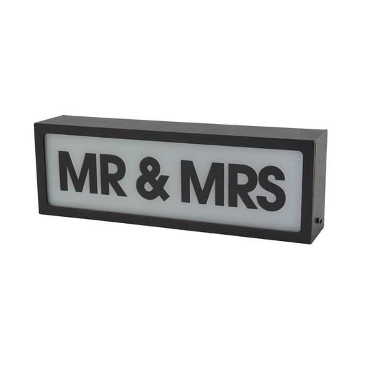 Rectangular sign with 'MR & MRS' text on a white background