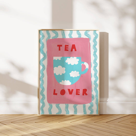 Framed artwork with a tea-themed design on a wooden floor.