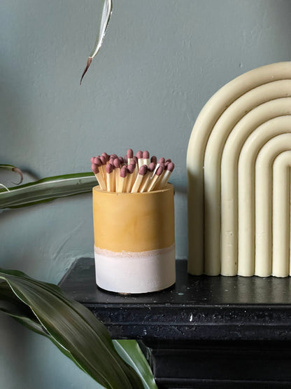Two tone match pot with striker