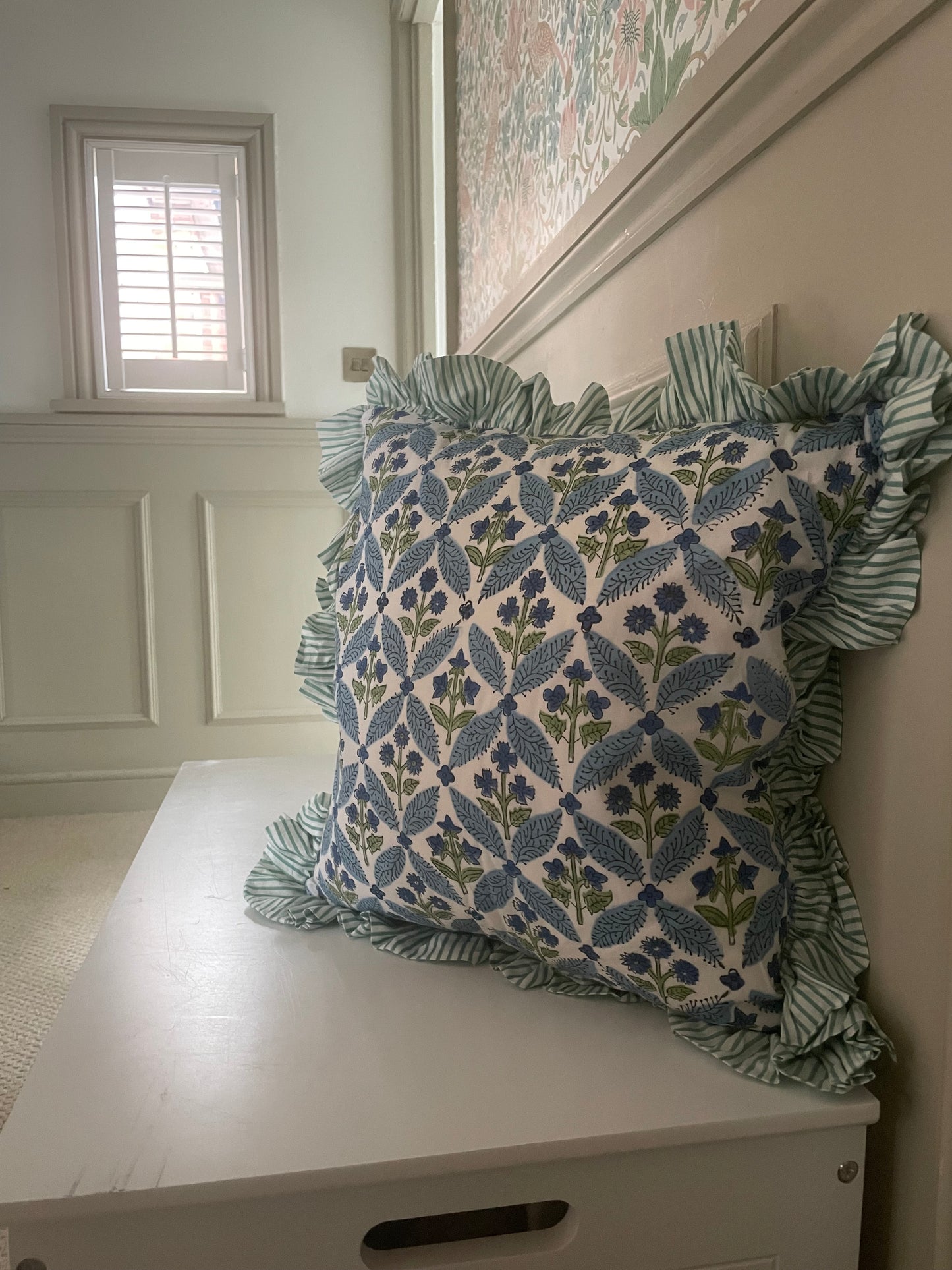 Handprinted blue and green floral cushion with striped frill