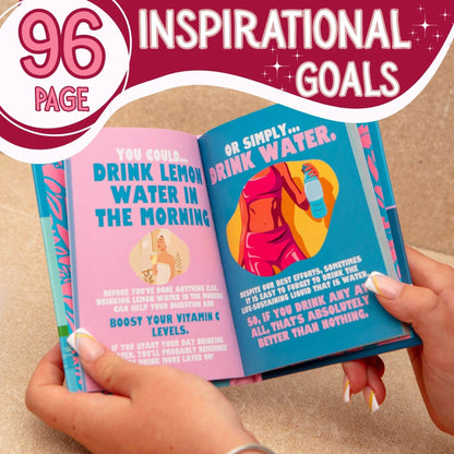 Open book with motivational text on pages, held by a hand against a beige background