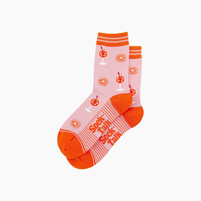 Pink and orange socks with text and graphics on a white background