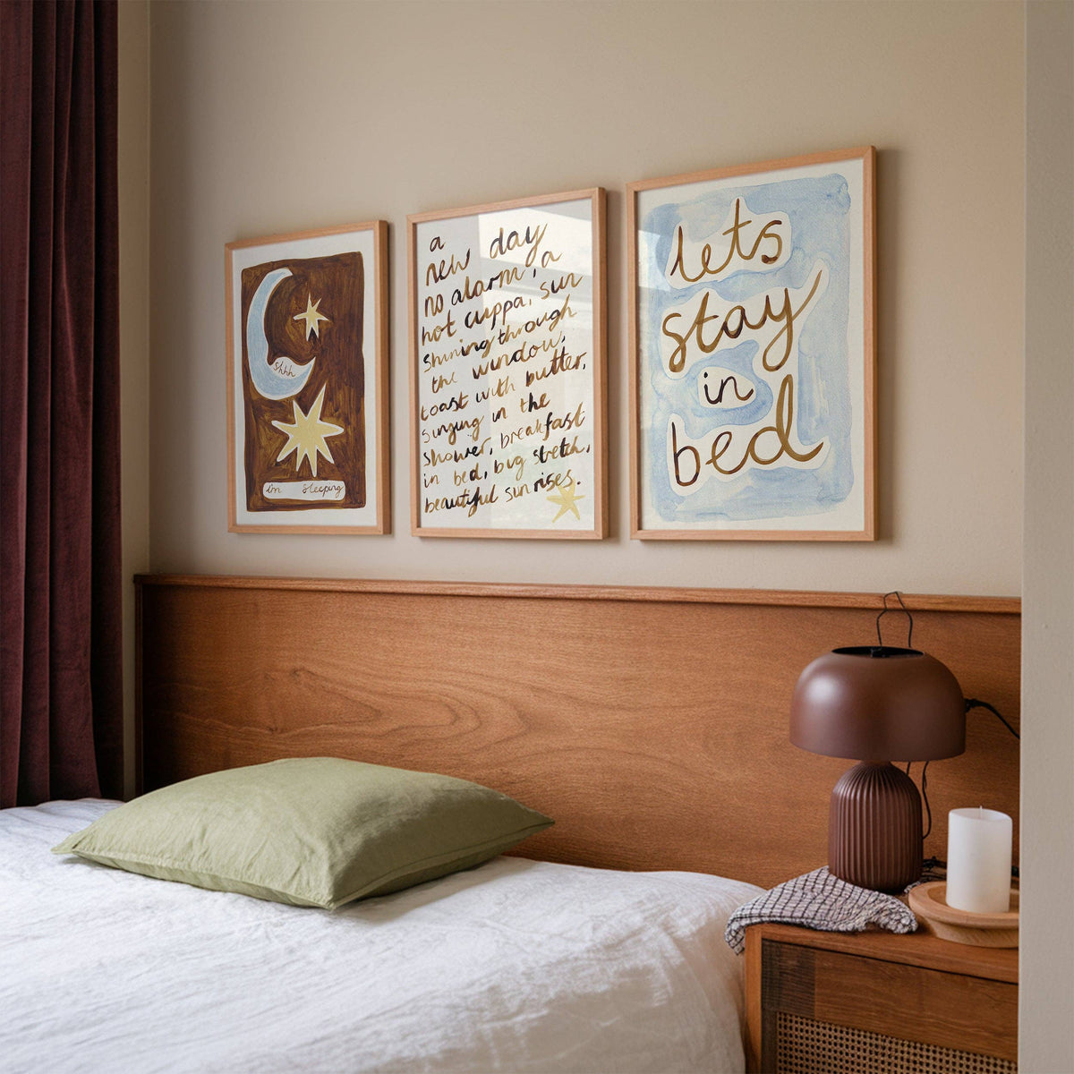 Bedroom with wooden headboard, framed artwork, and bedside table with lamp.