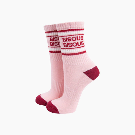Pink socks with red text and accents on a white background