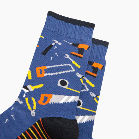 Blue socks with tool designs on a white background