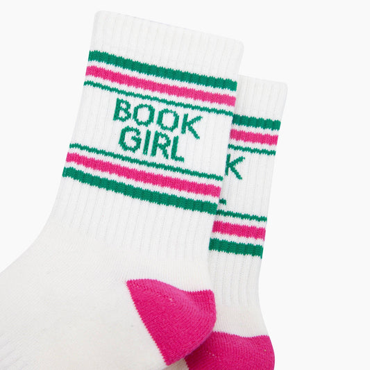 White sock with green and pink stripes and 'BOOK GIRL' text on a white background