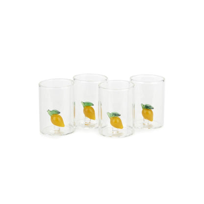 Set of four clear glasses with lemon illustrations on a white background