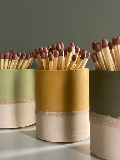 Two tone match pot with striker
