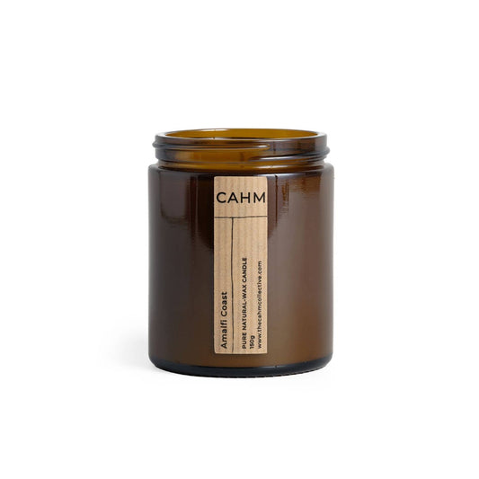 Brown candle jar with a label on a white background