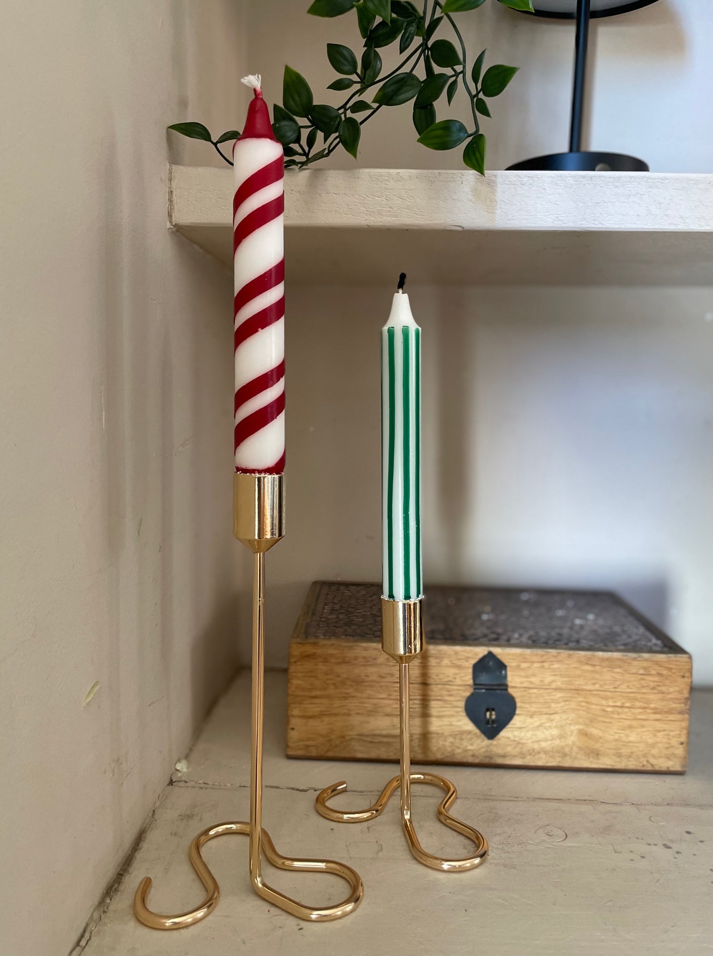 Green and white vertical striped candles