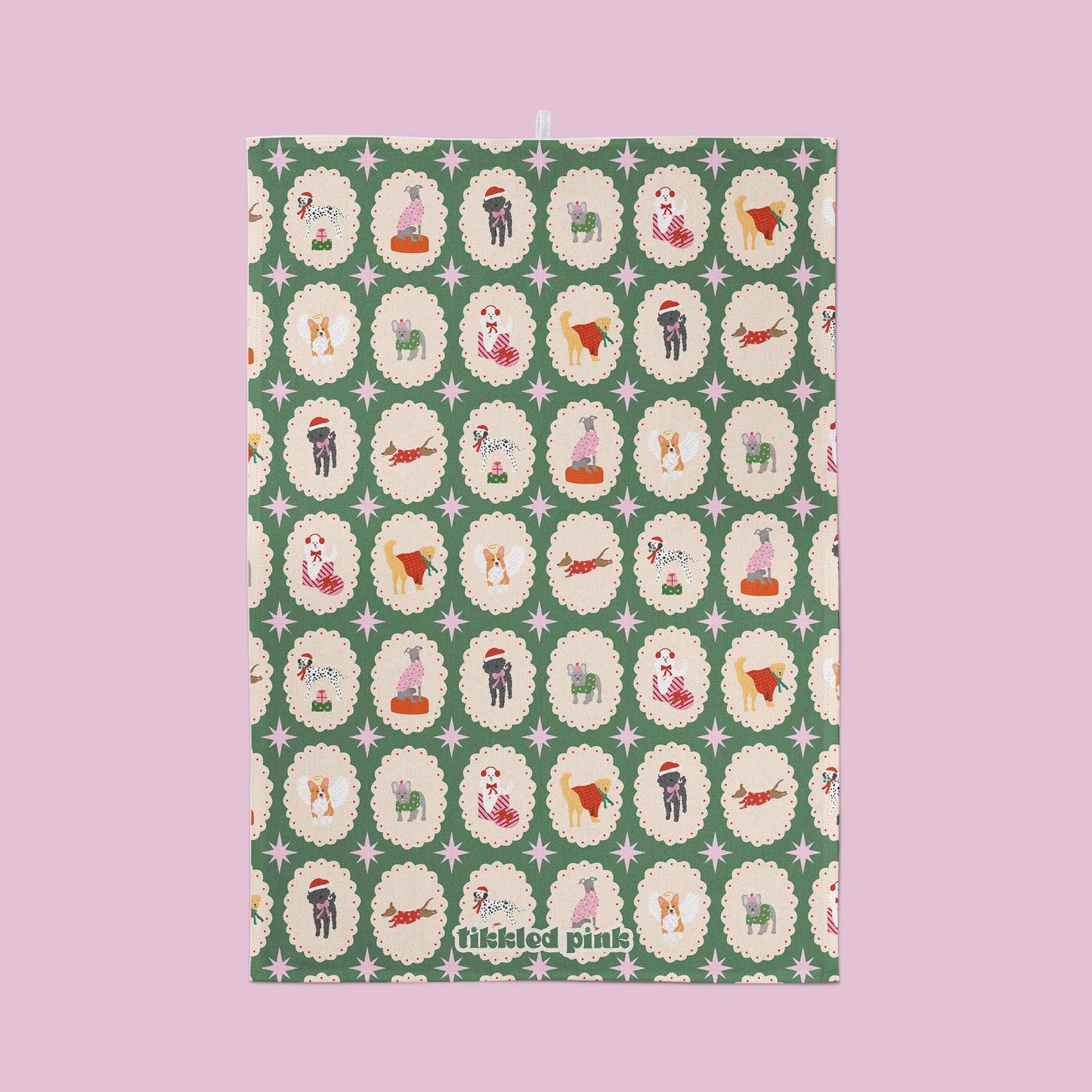 Patterned dog characters on a green background with 'tiddled pink' branding.
