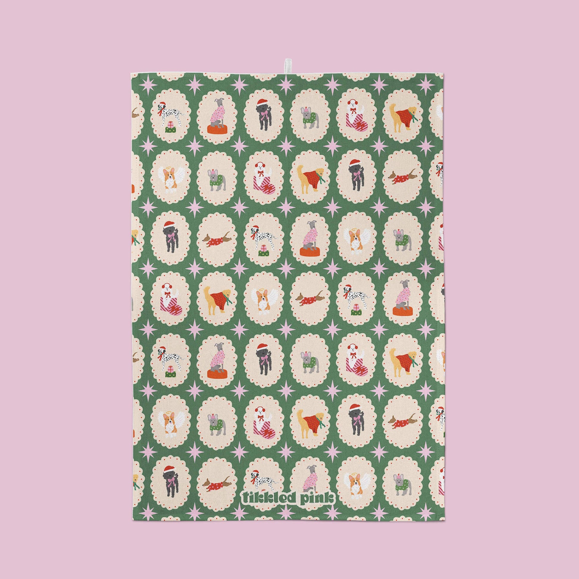 Patterned dog characters on a green background with 'tiddled pink' branding.