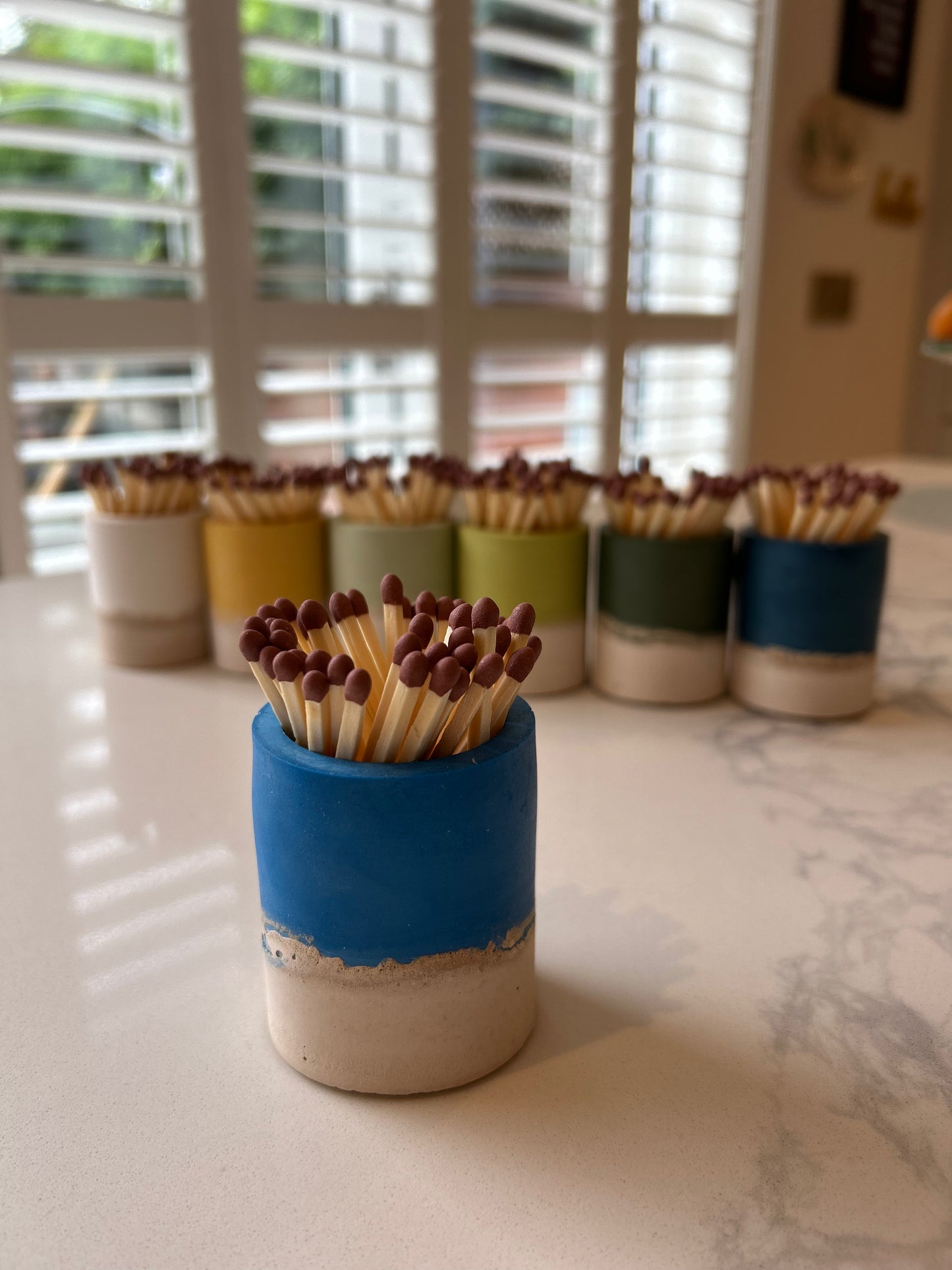 Two tone match pot with striker