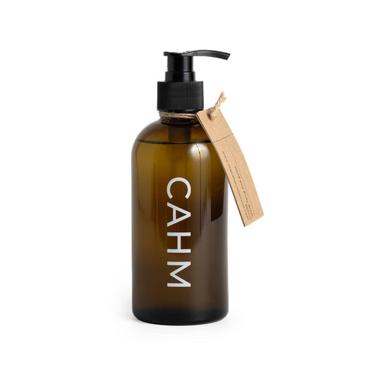 Brown bottle with pump and 'CAHM' label on a white background