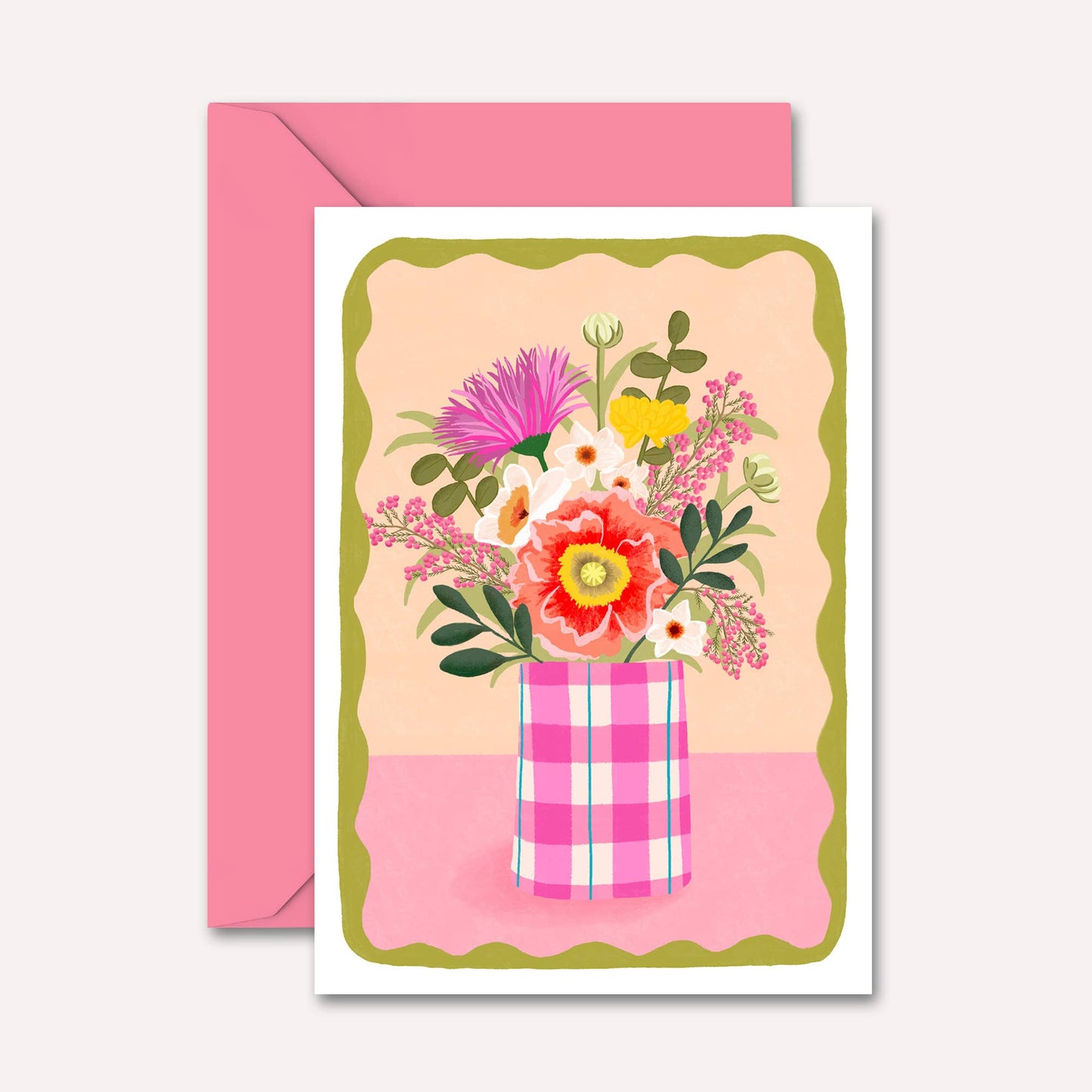 Greeting card with floral design and pink envelope on a white background