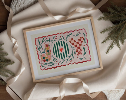 Framed JOY artwork with decorative design on a soft fabric background