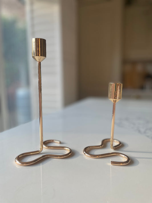 Gold candle holder with squiggly base