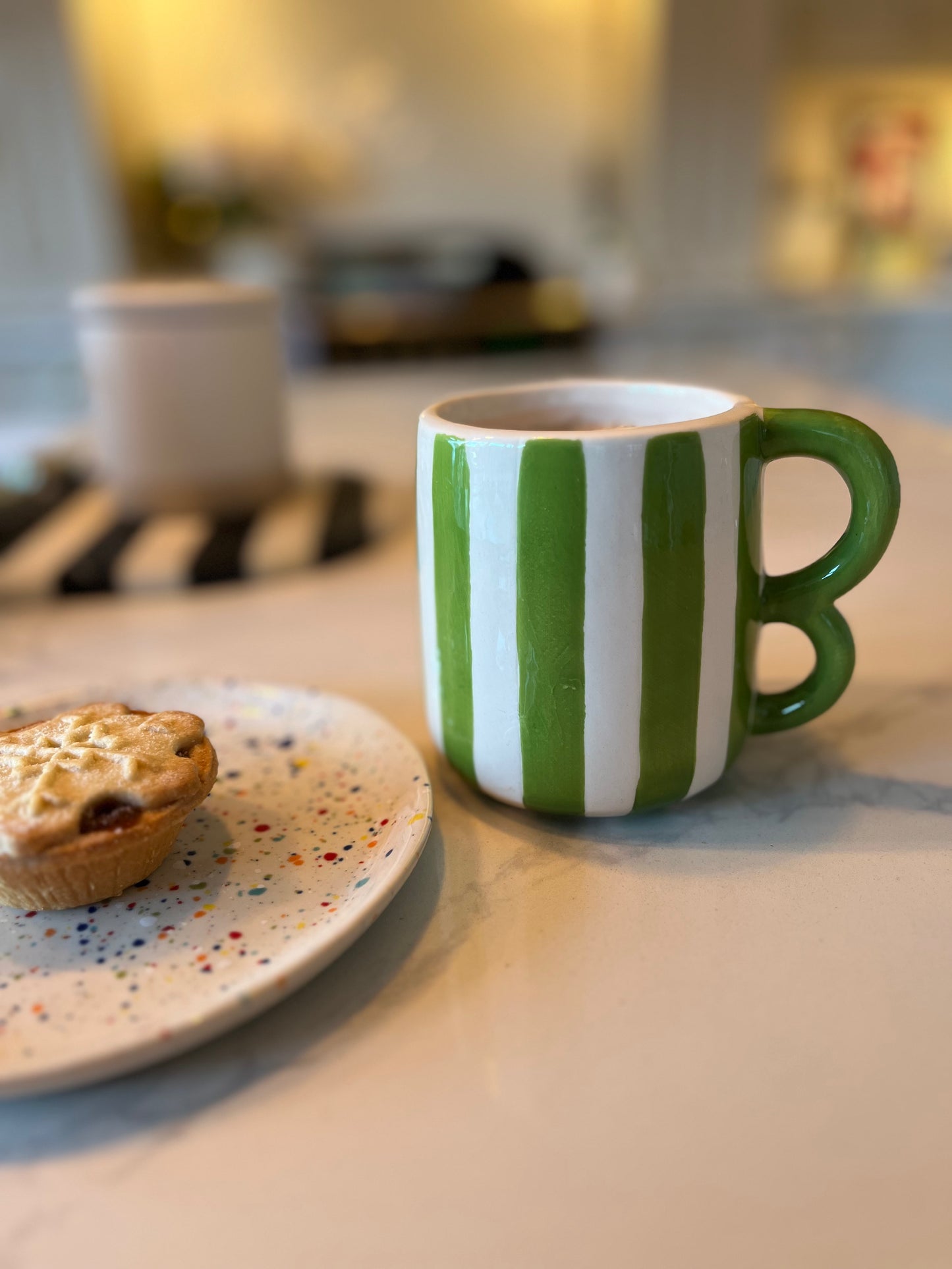 Green striped mugs with wavy handle