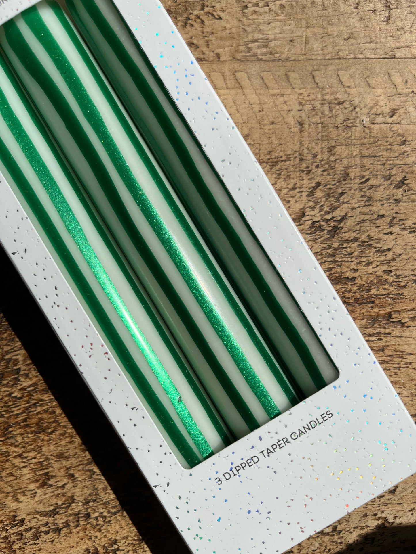 Green and white vertical striped candles