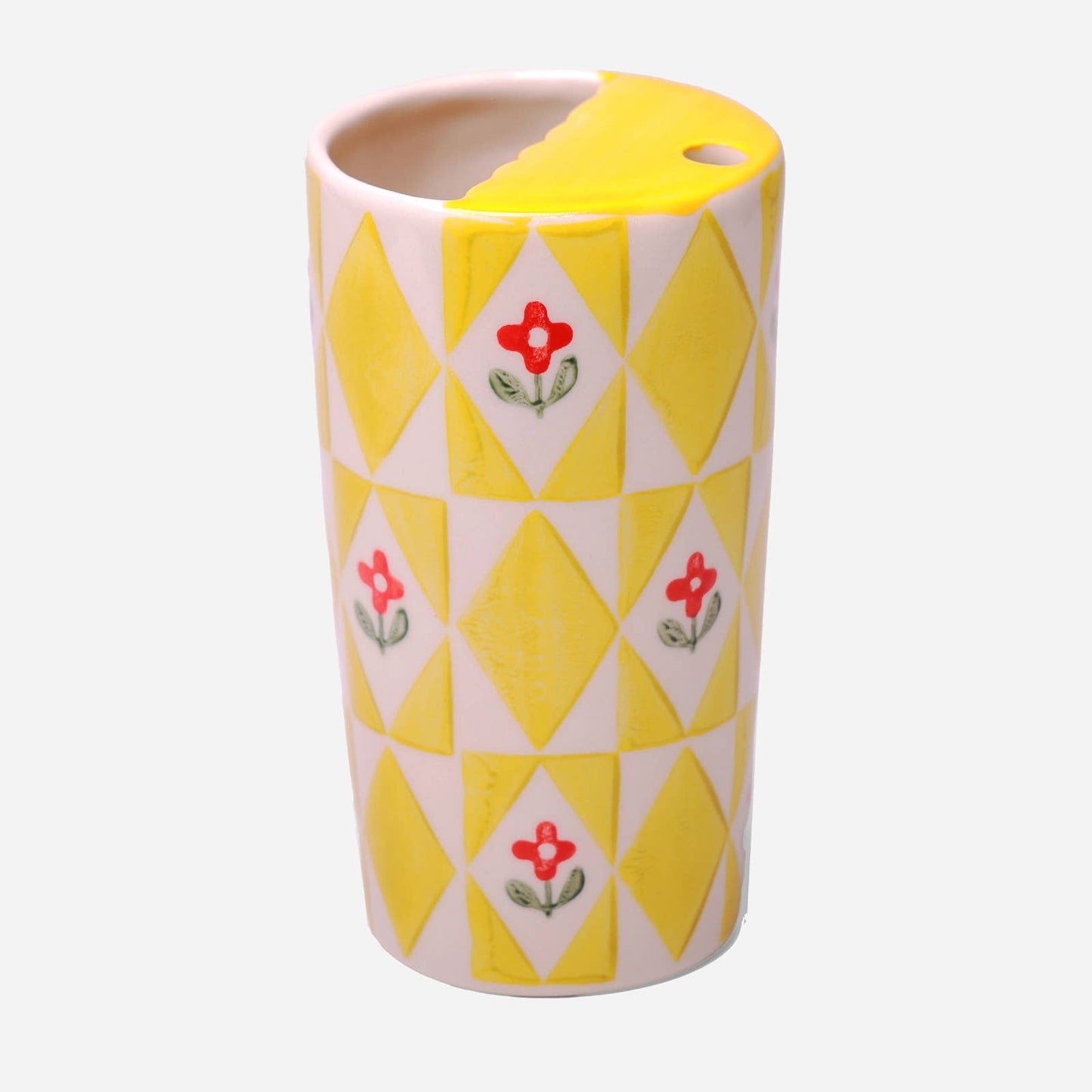 Cylindrical ceramic vase with geometric pattern and floral design on a white background