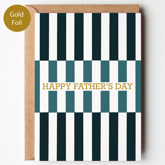Greeting card with black and white striped pattern and gold foil text 'Happy Father's Day' on a white background.