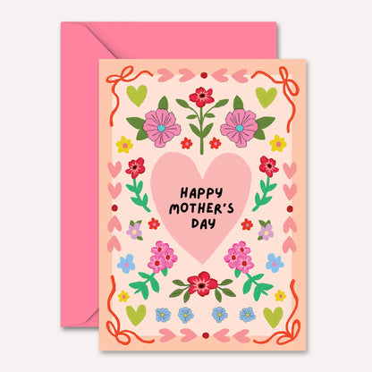 Greeting card with floral design and 'Happy Mother's Day' text, featuring a pink envelope.