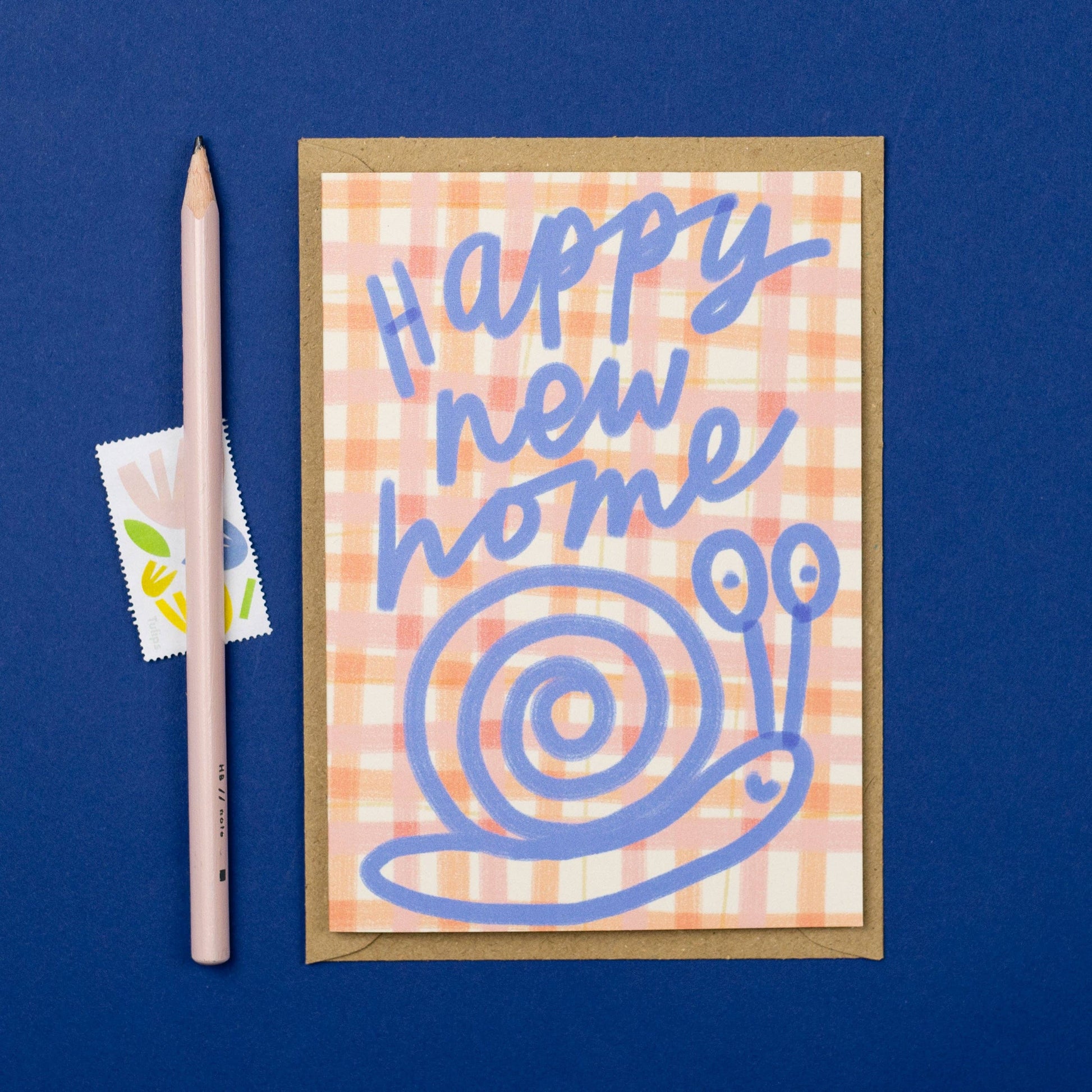Greeting card with 'Happy new home' text and snail illustration on a blue background
