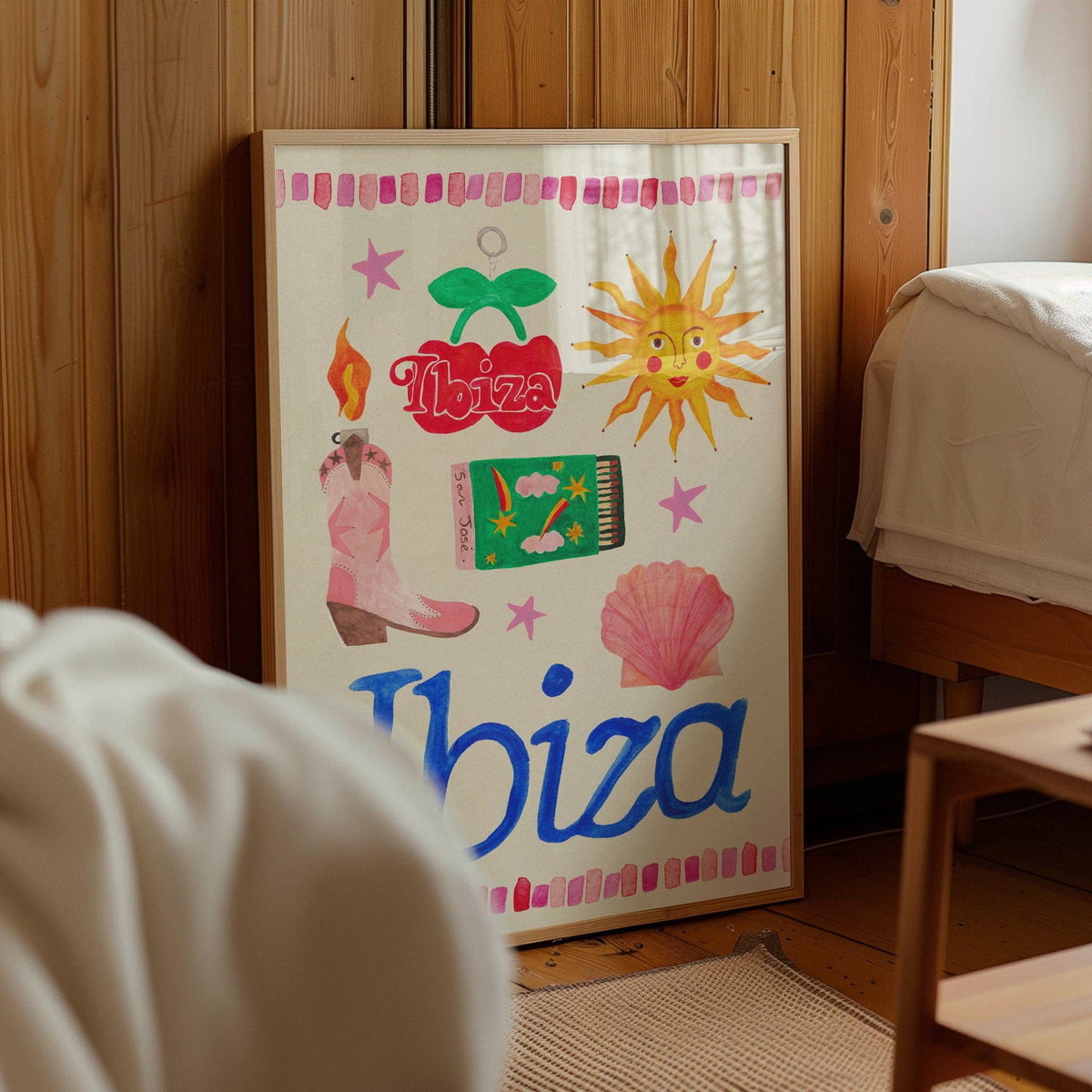 Colorful 'Ibiza' themed poster on a wooden wall.