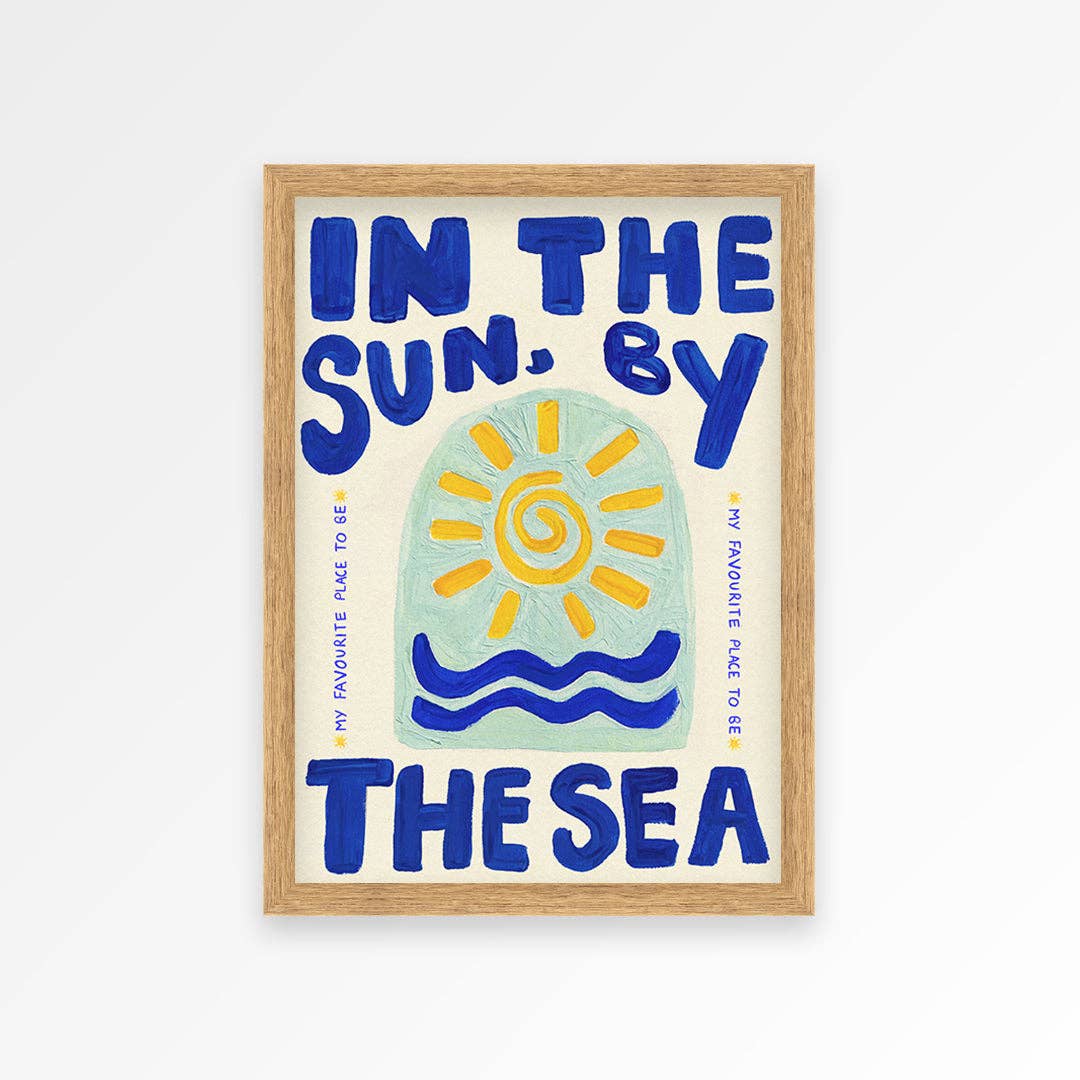 Framed artwork with a sun and wave design and text on a white background