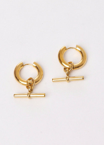 Gold hoop earrings with additional gold bars on a white background