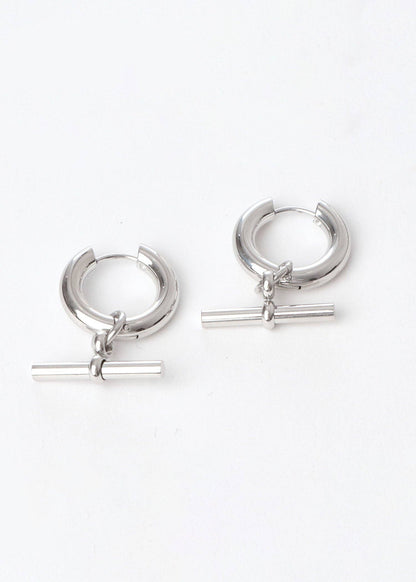 Pair of silver hoop earrings with horizontal bars on a white background