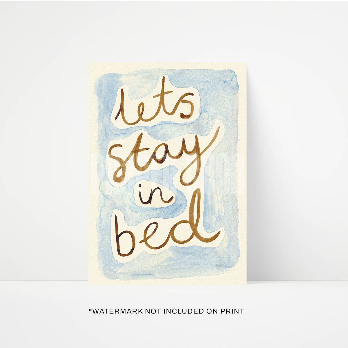 Card with 'Let's stay in bed' text on a watercolor background