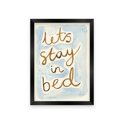 Framed artwork with 'Let's stay in bed' text on a watercolor background