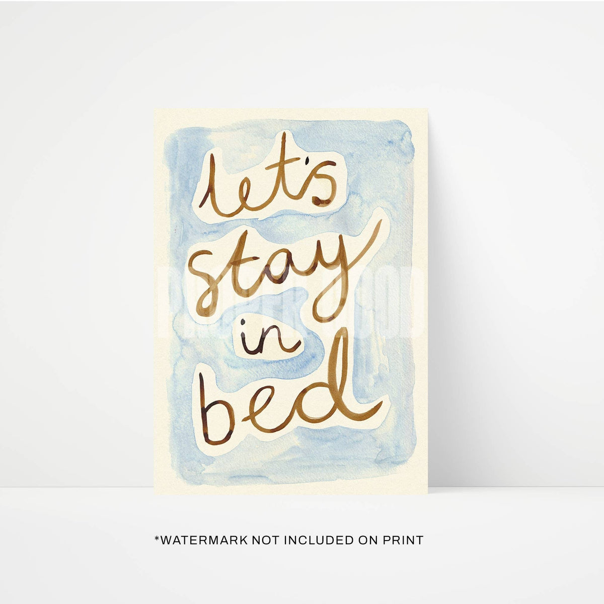 Card with 'Let's stay in bed' text on a watercolor background