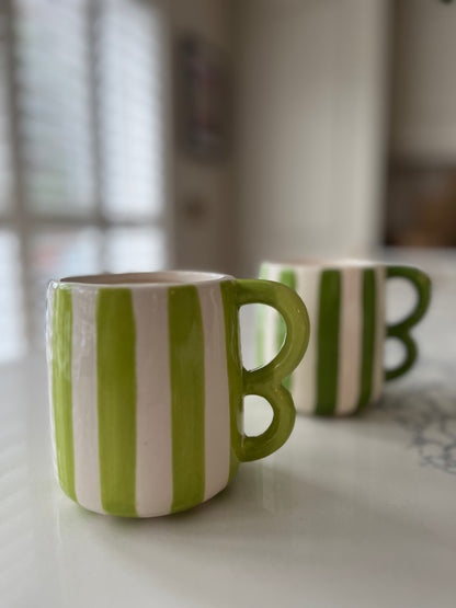 Green striped mugs with wavy handle