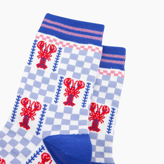 Pair of socks with lobster and checkered pattern on a white background