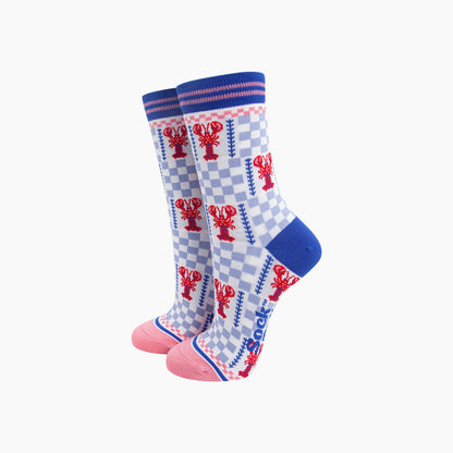 Pair of socks with lobster design on a checkered background