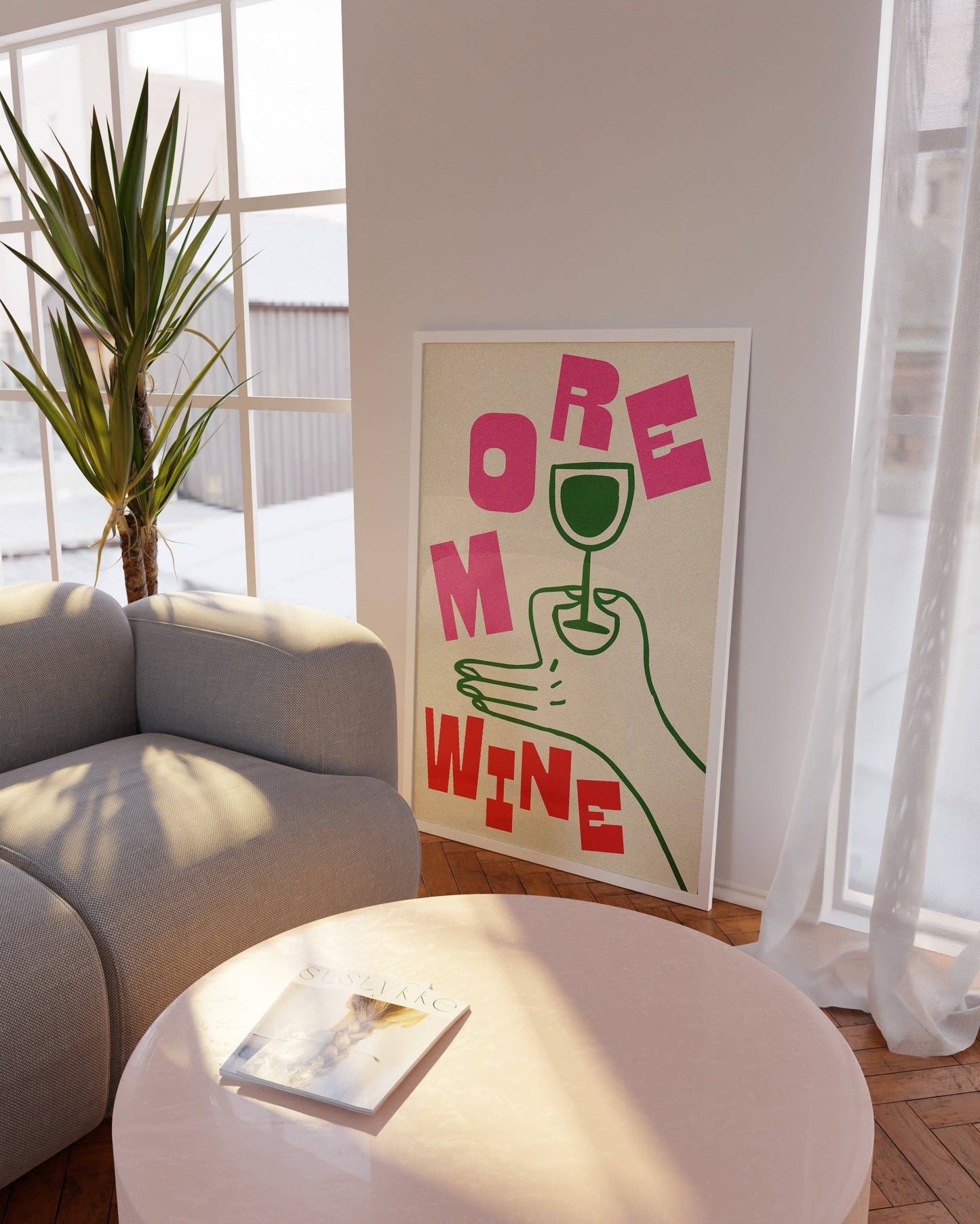 Modern living room with a 'More Wine' poster on the wall