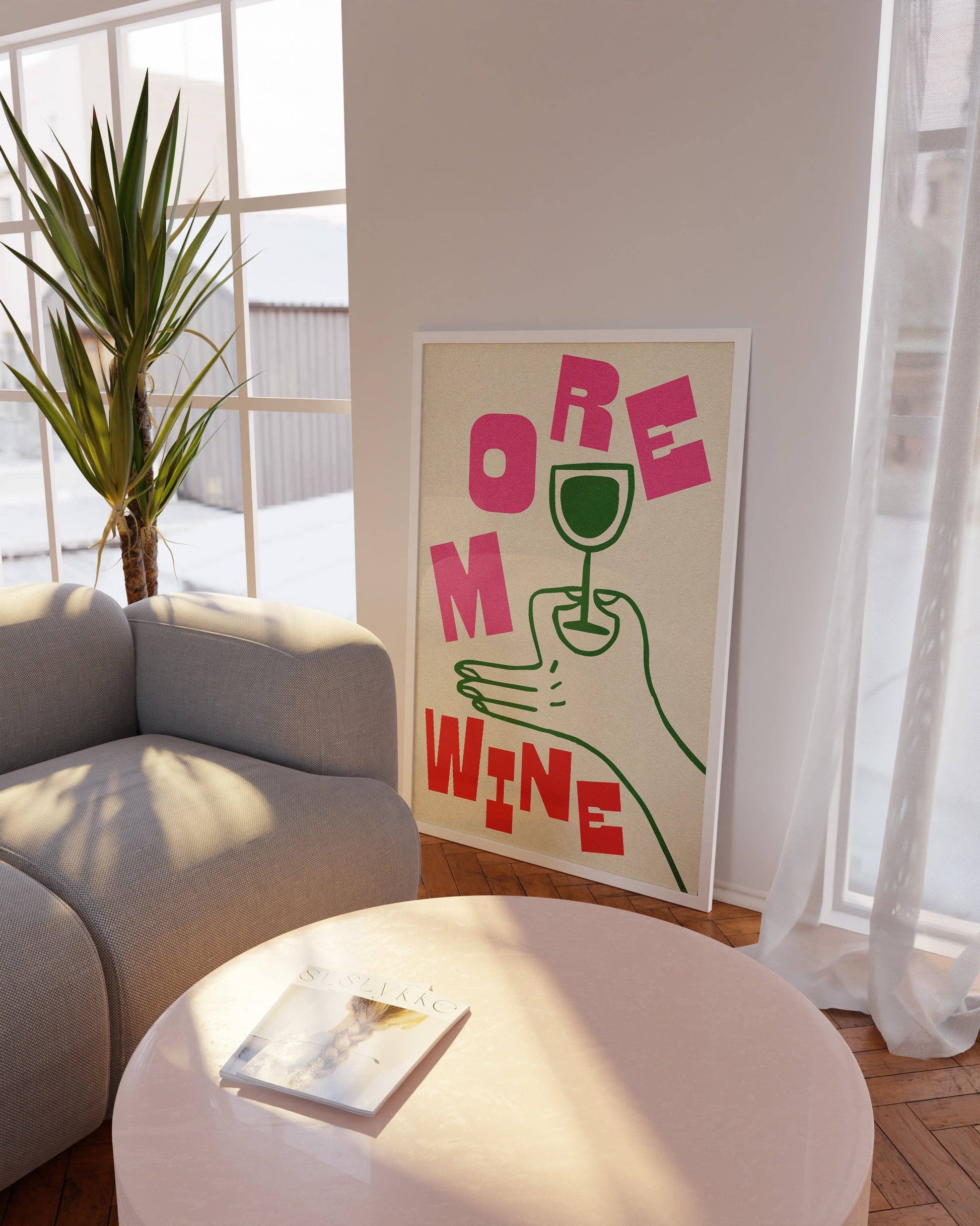 Modern living room with a 'More Wine' poster on the wall