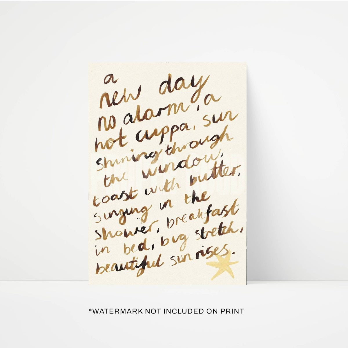 Print with gold cursive text on a beige background