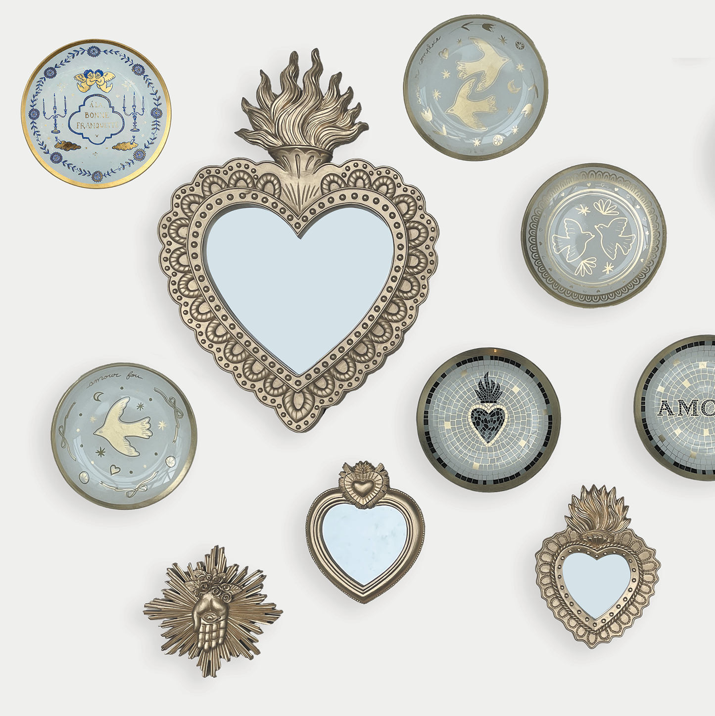 Collection of decorative heart-shaped mirrors and frames on a white background