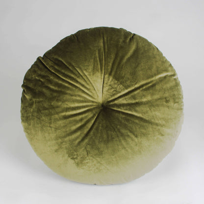 Green round velvet pillow on a white background